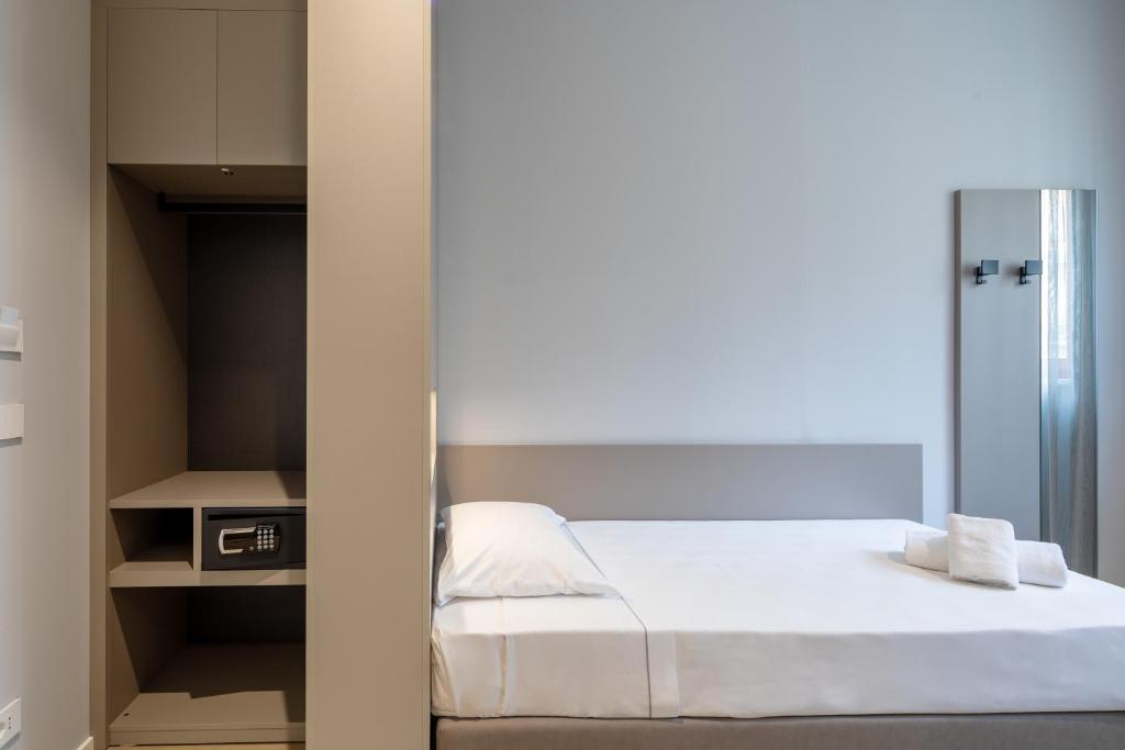 Postel nebo postele na pokoji v ubytování Hotel Excelsior Pavia
