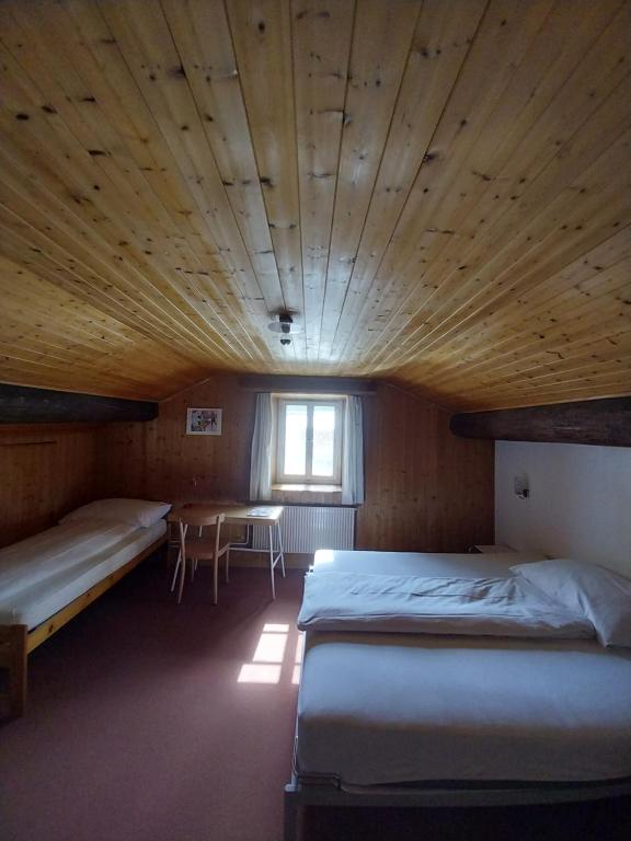 Postel nebo postele na pokoji v ubytování Hotel Alpina