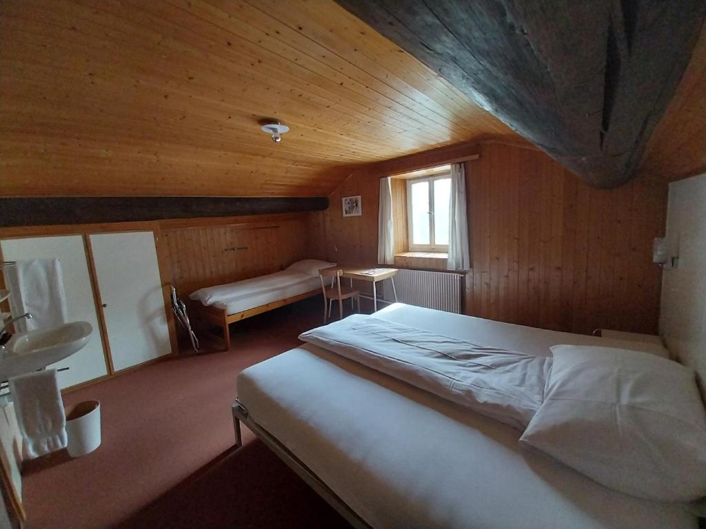 Postel nebo postele na pokoji v ubytování Hotel Alpina