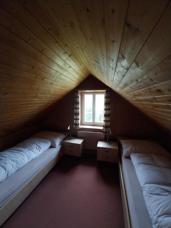 Postel nebo postele na pokoji v ubytování Hotel Alpina