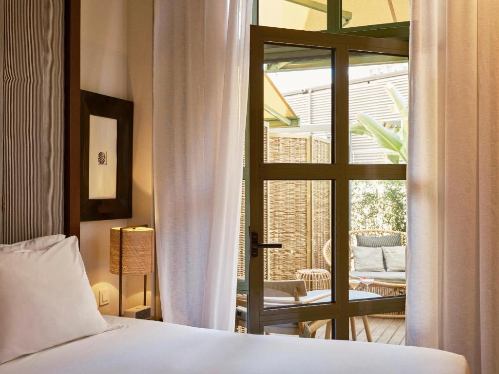 Posteľ alebo postele v izbe v ubytovaní Hotel Pulitzer Barcelona