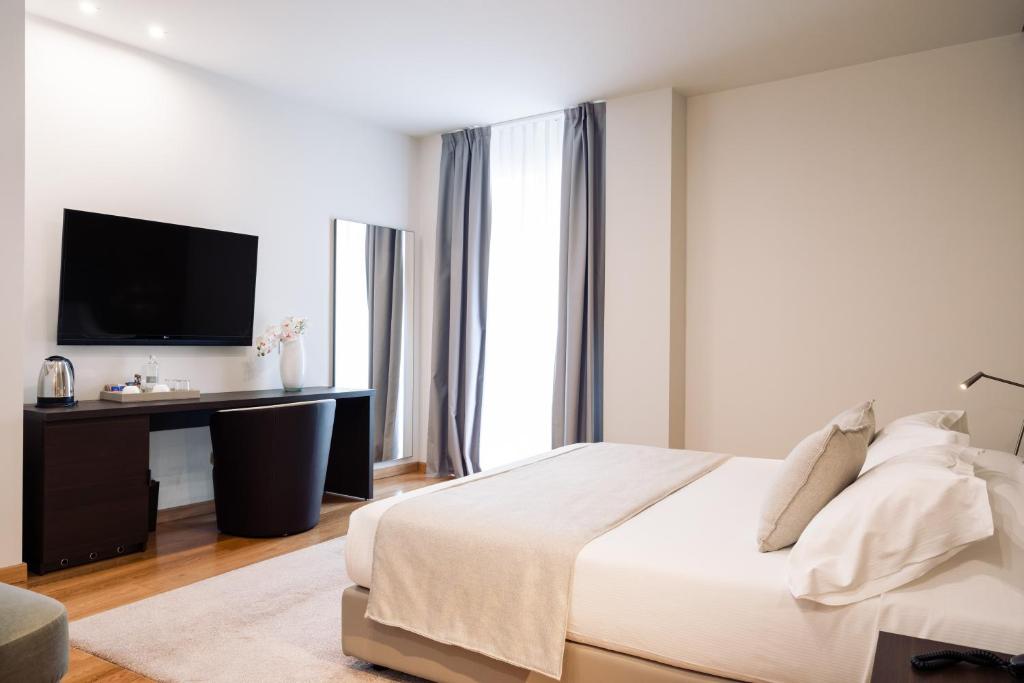 Posteľ alebo postele v izbe v ubytovaní Hotel Michelangelo
