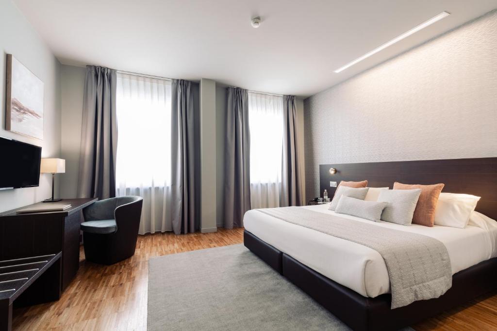 Posteľ alebo postele v izbe v ubytovaní Hotel Michelangelo