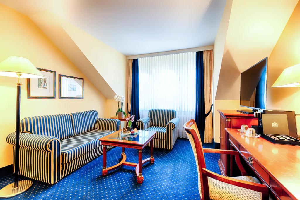 Uma TV ou centro de entretenimento em Hotel Villa Geyerswörth
