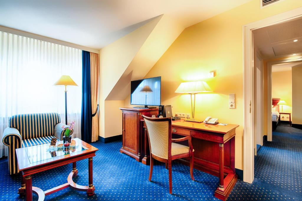 Uma TV ou centro de entretenimento em Hotel Villa Geyerswörth