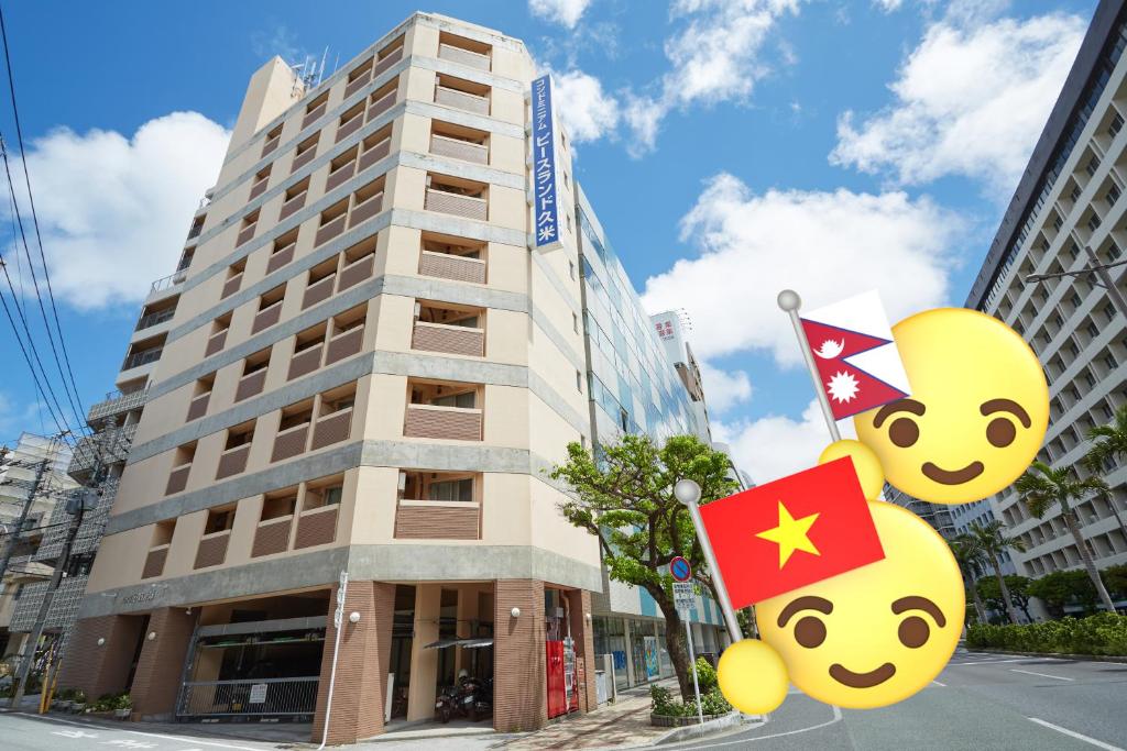 a building with hello kitty signs in front of it at Peace Land Kume in Naha