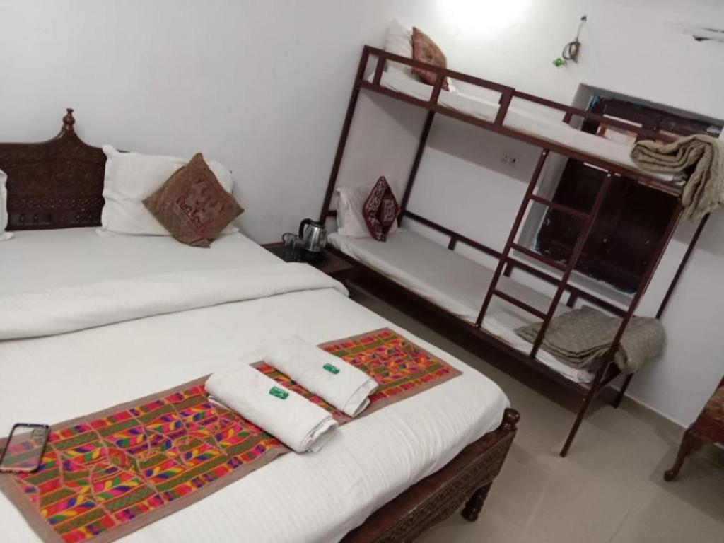Postel nebo postele na pokoji v ubytování Hotel Tofu safari