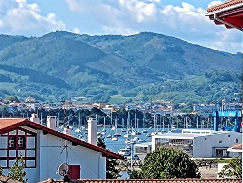 a view of a harbor with boats in the water at Hendaye plage, Résidence Eskualduna A in Hendaye