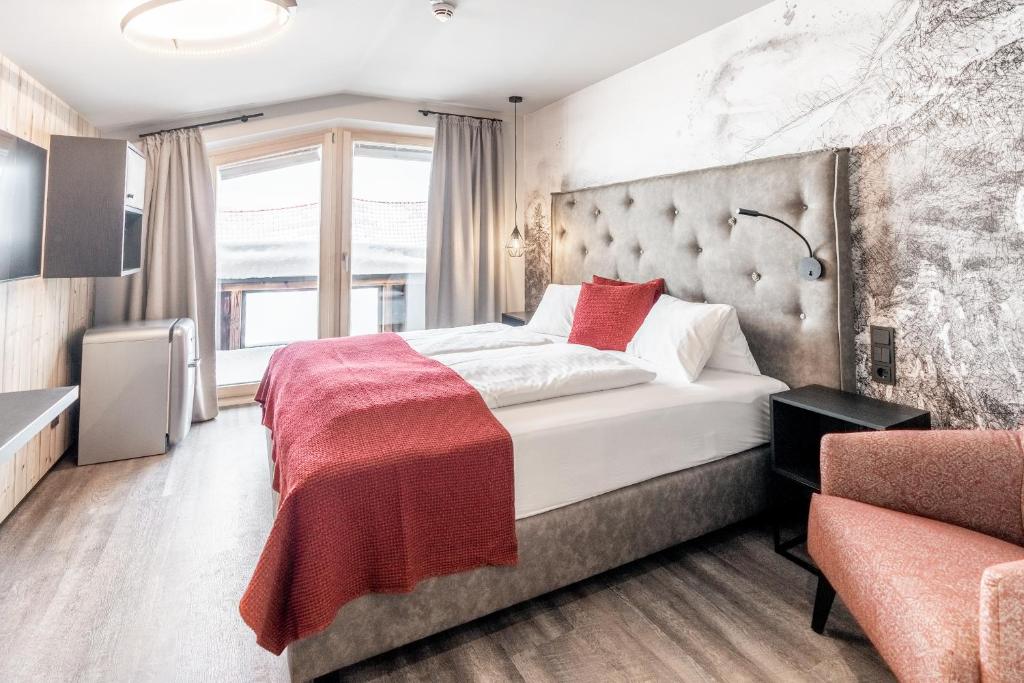 Postel nebo postele na pokoji v ubytování Hotel Astrid - inklusive kostenfreier JokerCard