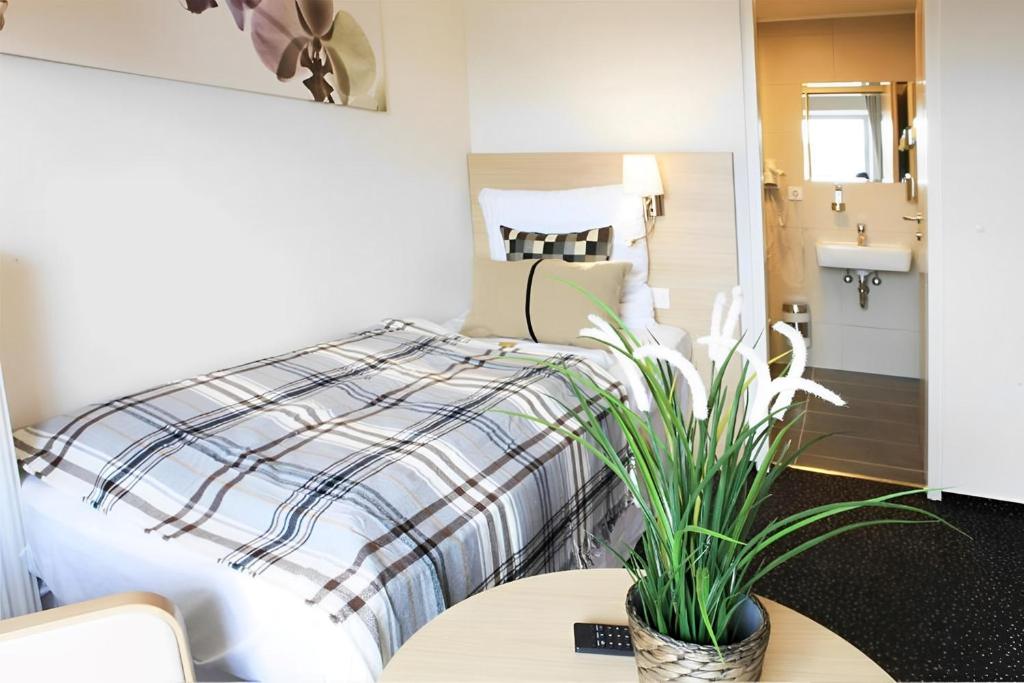 Postel nebo postele na pokoji v ubytování Sleephotels