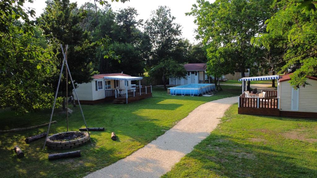 a yard with a playground and a play area at Del Falco AgriCamp-12 kilometers to Garda Lake and Verona in Bussolengo