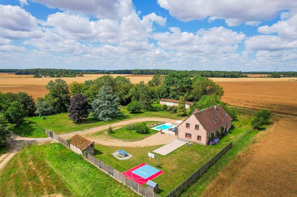 an aerial view of a house with a pool and a yard at Crazy Villa Chalonie 28 - Heated pool - Soccer - Basket - 2h Paris - 30p in Happonvilliers