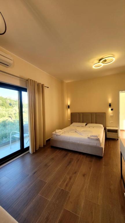Postel nebo postele na pokoji v ubytování Sweet Home Himara