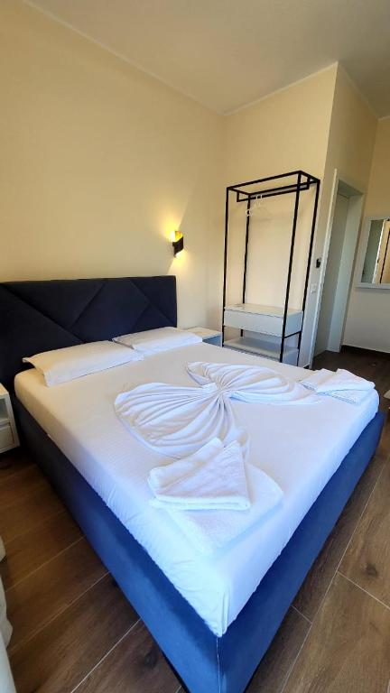 Postel nebo postele na pokoji v ubytování Sweet Home Himara