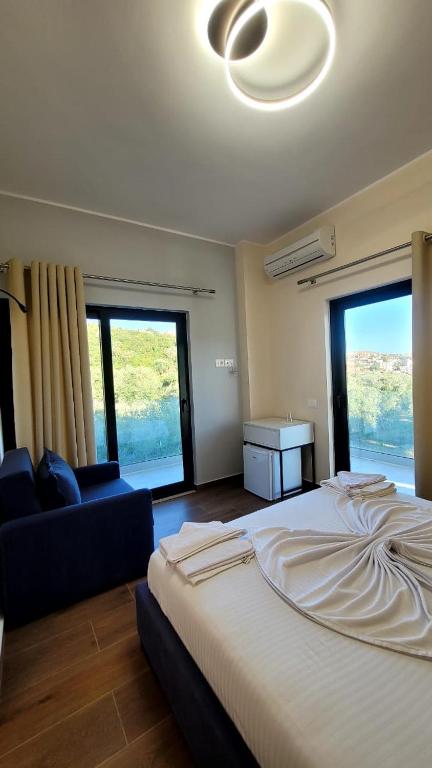 Postel nebo postele na pokoji v ubytování Sweet Home Himara
