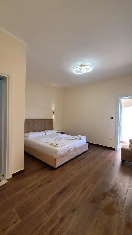 Postel nebo postele na pokoji v ubytování Sweet Home Himara