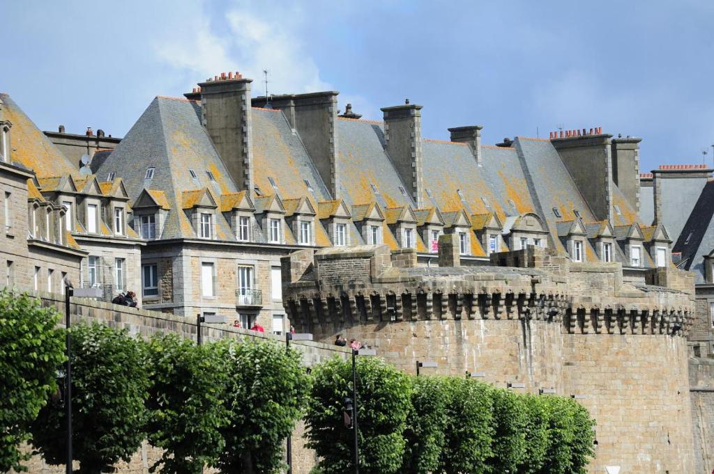 a large building with a roof on top of it at La porcherie du pet en l&#39;air in Saint Malo