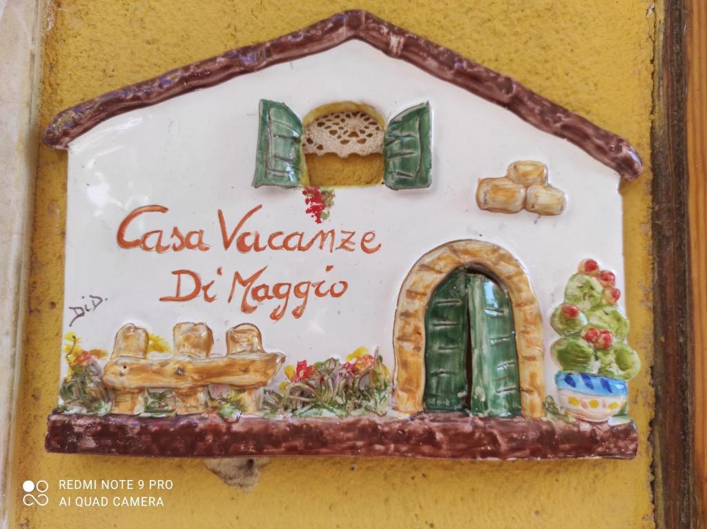 a sign for a bakery on a wall at Casa Vacanza Di Maggio in Cinisi