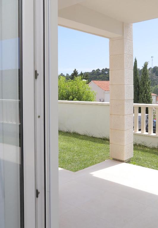 an open door to a balcony with a view at Apartmani Krmek in Mlini