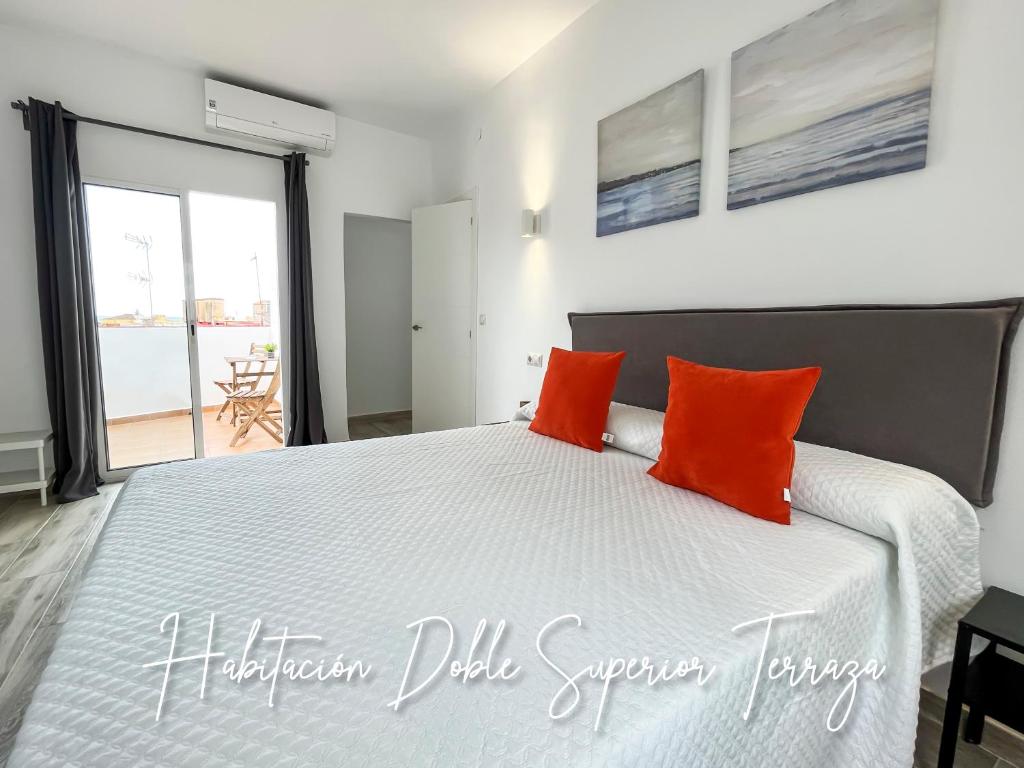 Posteľ alebo postele v izbe v ubytovaní Micaela Charming Hostal