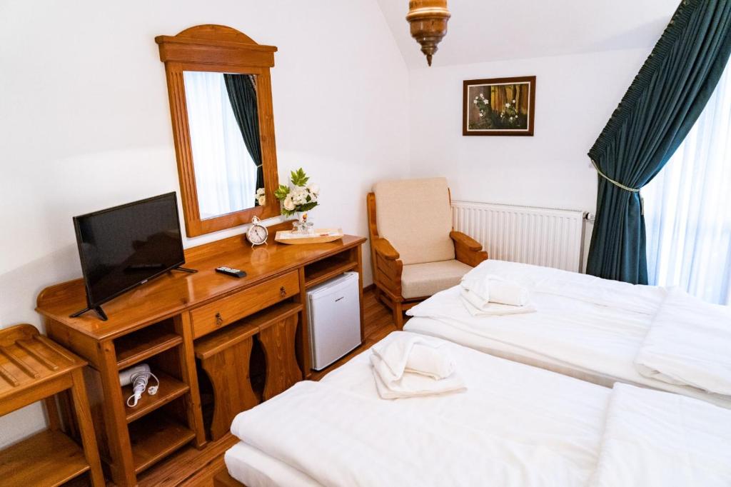 Postel nebo postele na pokoji v ubytování 5.Evszak