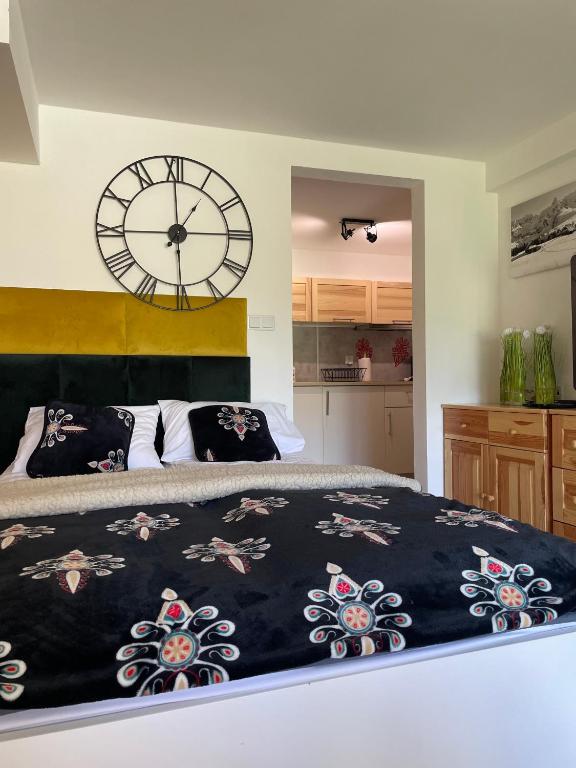 Posteľ alebo postele v izbe v ubytovaní Apartamenty Biatlonowe