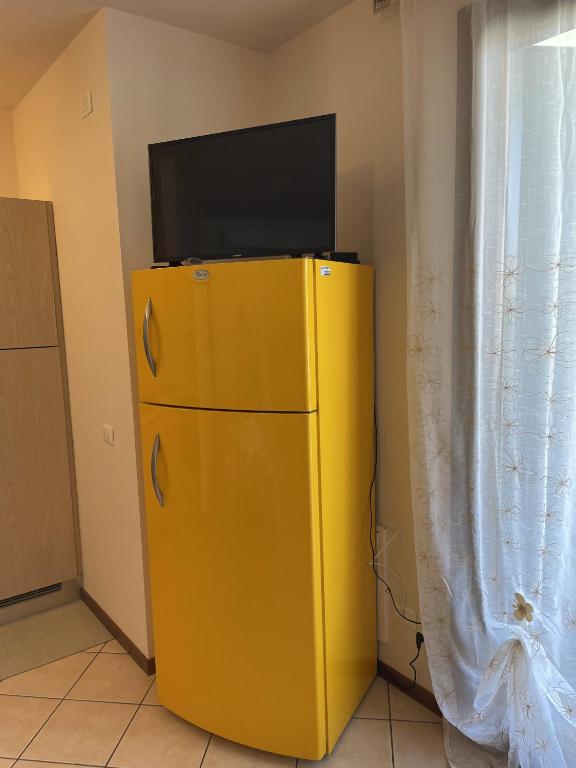 TV a/nebo společenská místnost v ubytování Appartamento Diana