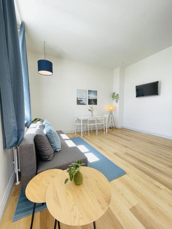 Et tv og/eller underholdning på aday - Blue light suite apartment in the center of Hjorring