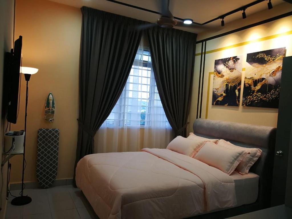 a bedroom with a large bed and a window at Bayu D'Awan Muslim Homestay Putrajaya in Putrajaya