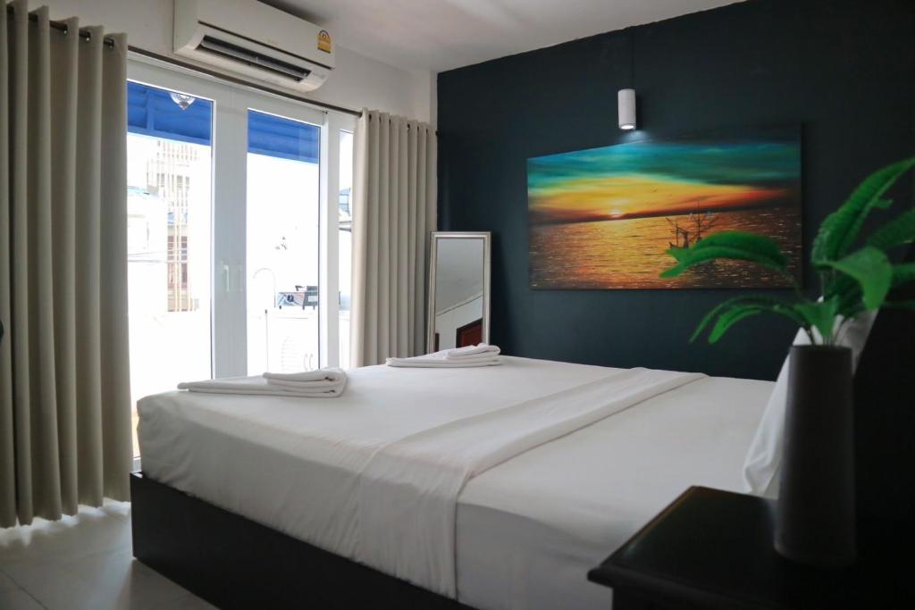 Postel nebo postele na pokoji v ubytování Sunshine Guest House