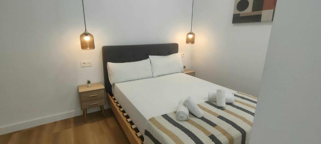 Postel nebo postele na pokoji v ubytování Calle Carmen Sevilla Centro Histórico