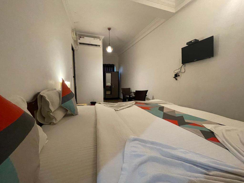 Postel nebo postele na pokoji v ubytování Baga View Inn