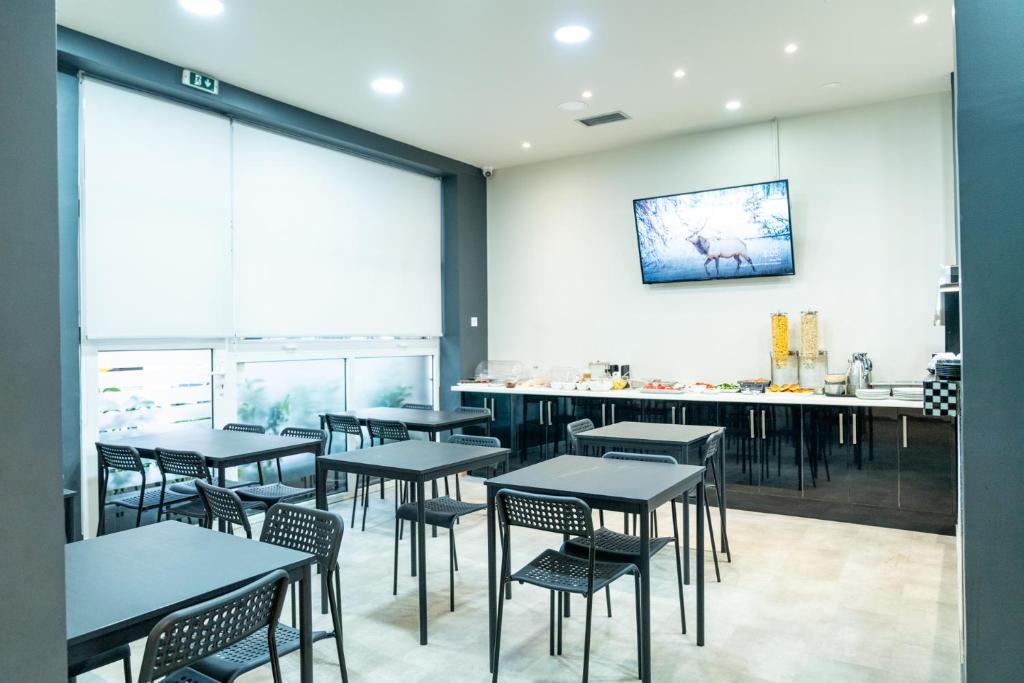 TV a/nebo společenská místnost v ubytování New Amaryllis Hotel