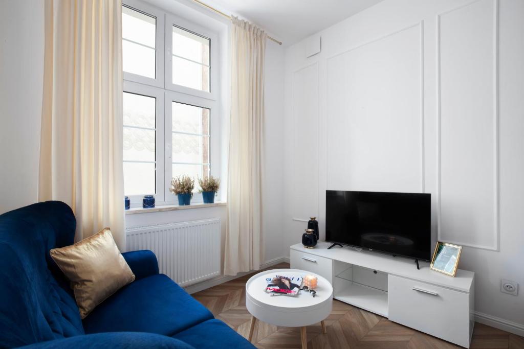 En TV eller et underholdningssystem på Elite Apartments Carrara