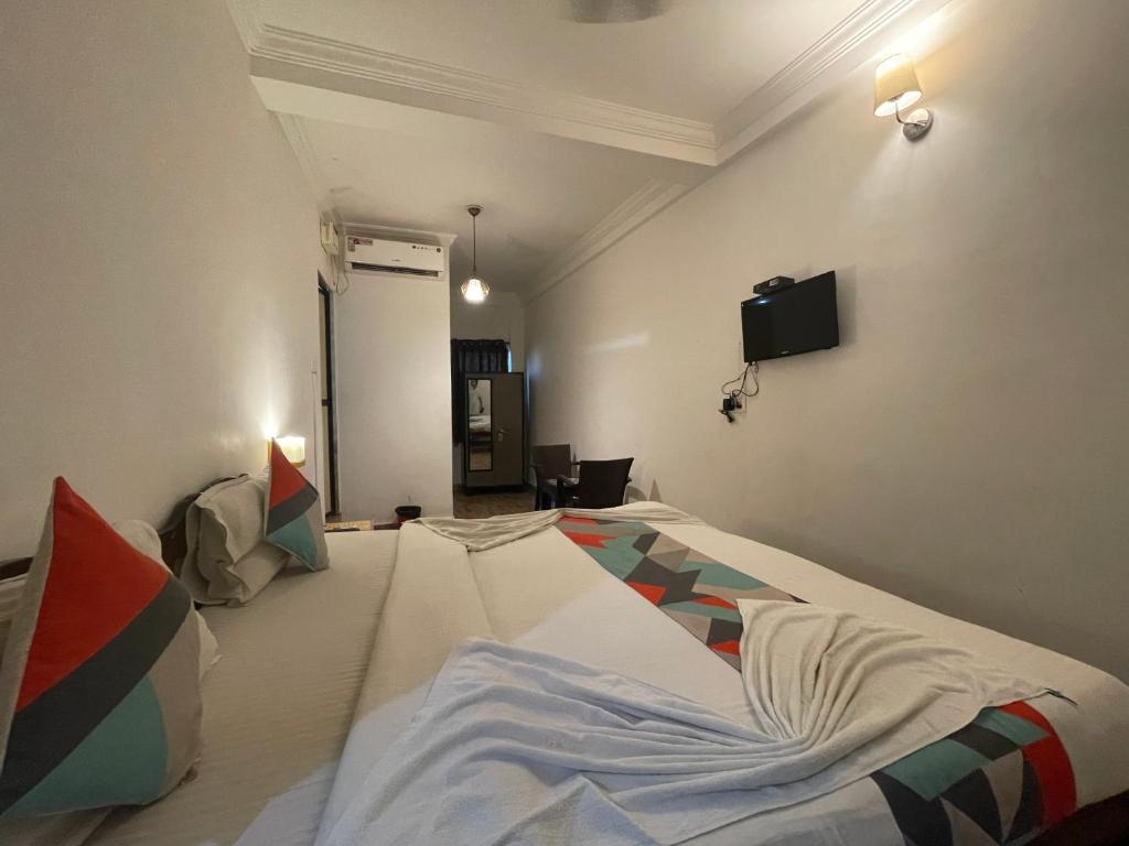 Postel nebo postele na pokoji v ubytování Baga View Inn