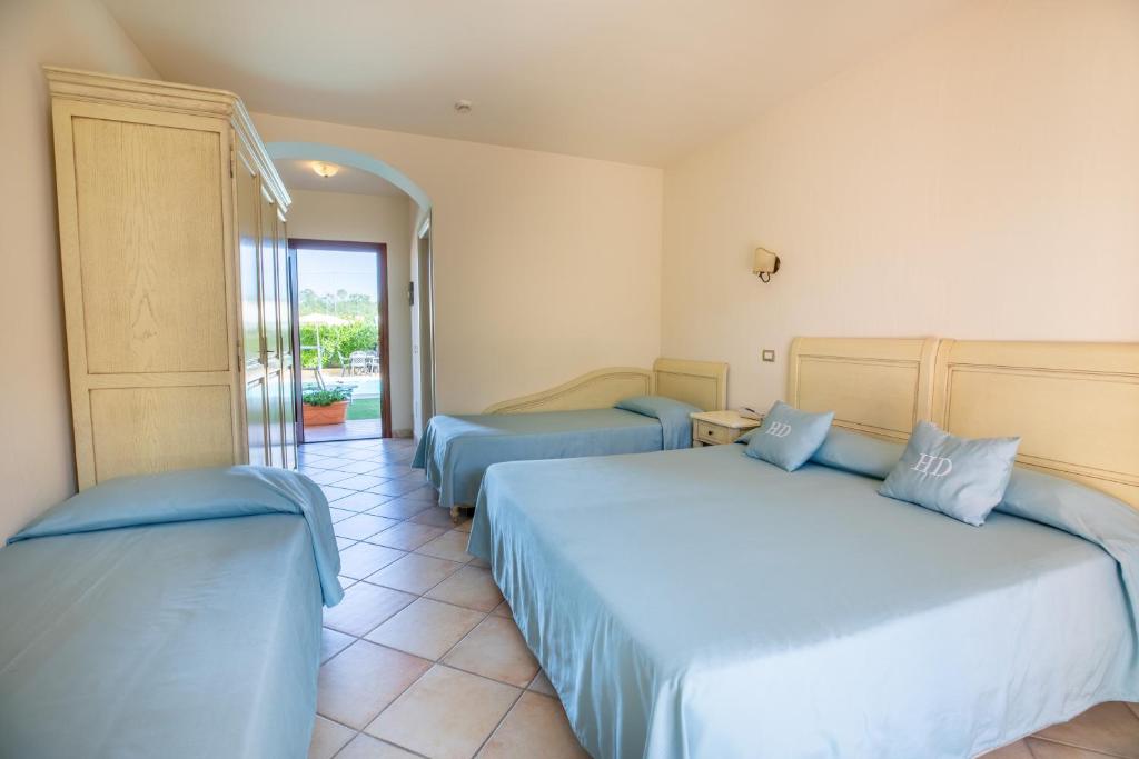 Postel nebo postele na pokoji v ubytování Hotel Daniel