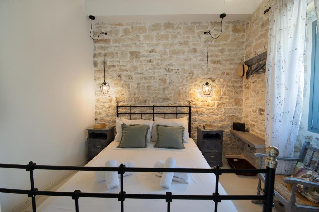Postel nebo postele na pokoji v ubytování Malethonas Cottage by All About Paxos