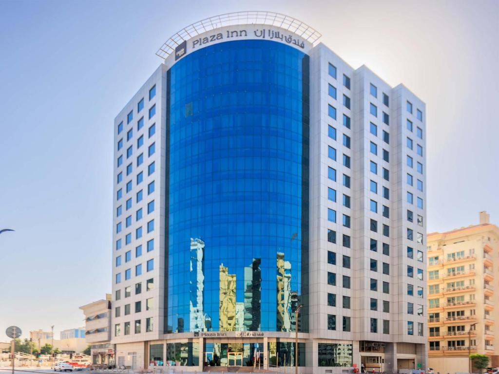 a large blue building with the words panama harcourt building at Plaza Inn Doha in Doha