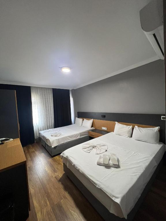 A bed or beds in a room at Hotel Otağ