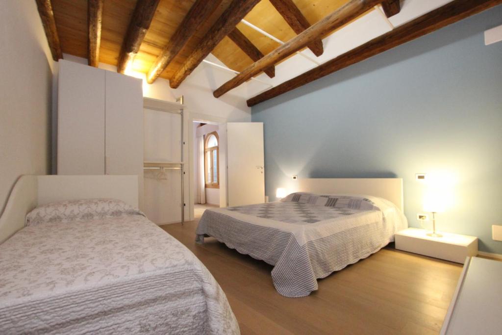 Posteľ alebo postele v izbe v ubytovaní City Apartments Rialto Market