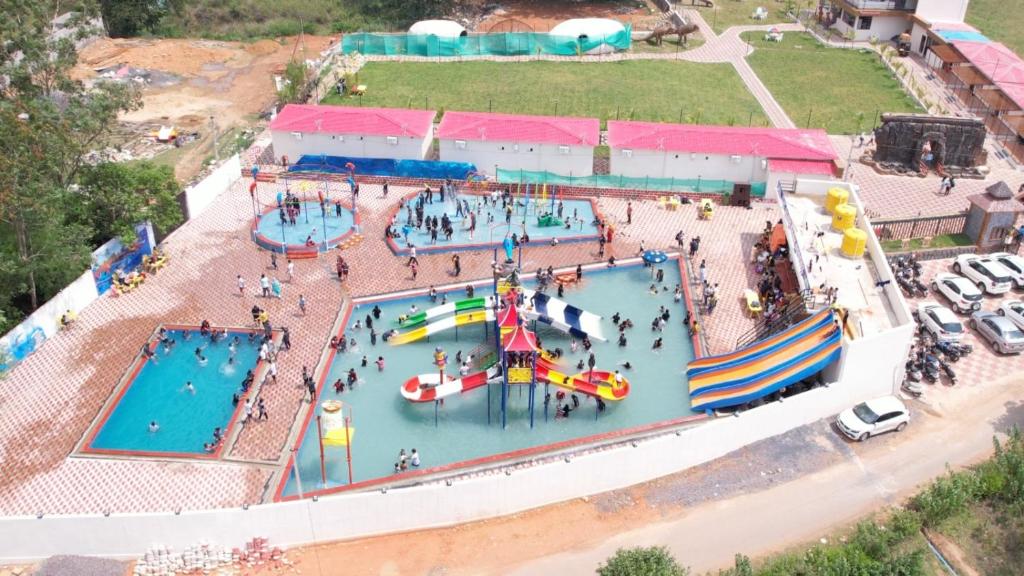 an overhead view of a water park with a pool at The River Park Resort in Jagdalpur