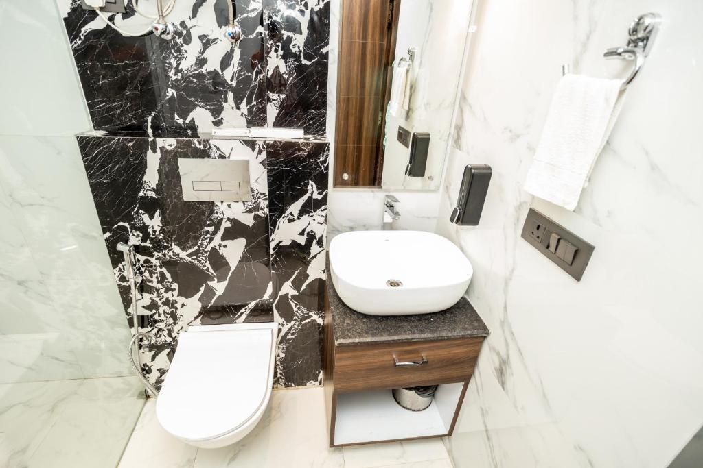 Koupelna v ubytování Hyphen Business Hotel