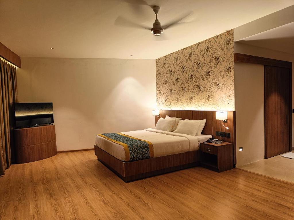 Postel nebo postele na pokoji v ubytování Hotel Sky Sierra Wayanad