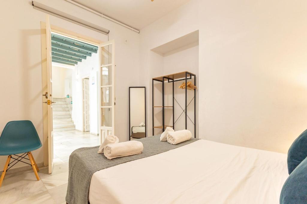 Postel nebo postele na pokoji v ubytování Casa en el Centro de Sevilla