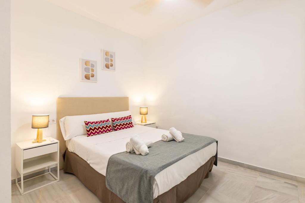 Postel nebo postele na pokoji v ubytování Casa en el Centro de Sevilla