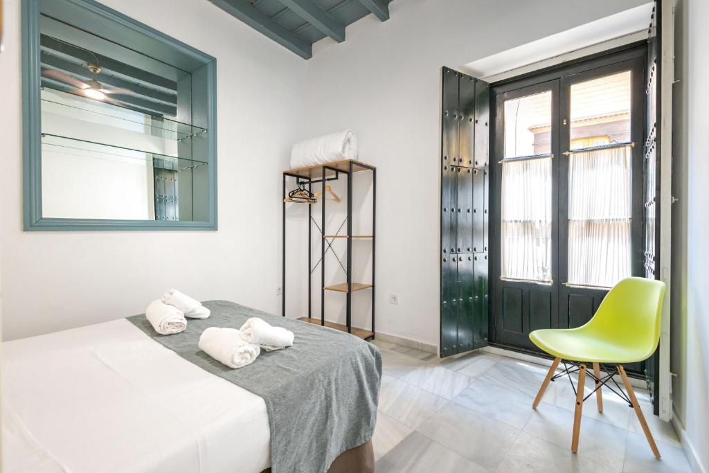 Postel nebo postele na pokoji v ubytování Casa en el Centro de Sevilla