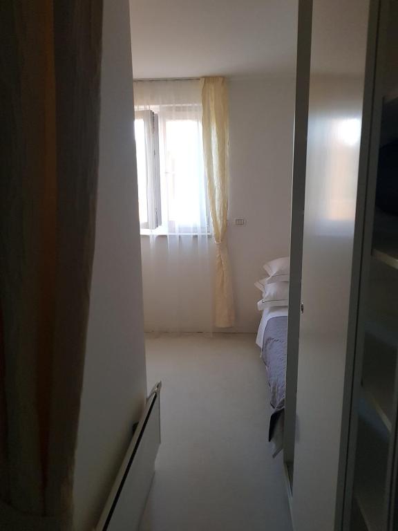 Postel nebo postele na pokoji v ubytování Apartments Fontana Zambratija