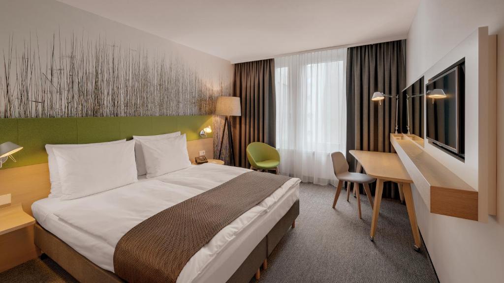 Cama ou camas em um quarto em Holiday Inn Frankfurt - Alte Oper by IHG