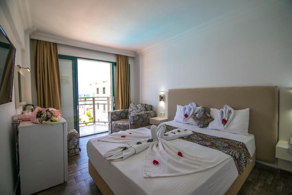 Postel nebo postele na pokoji v ubytování Bahar Hotels