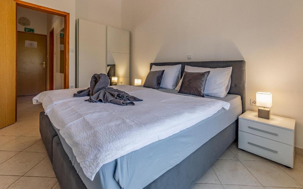 Postel nebo postele na pokoji v ubytování Apartments Rok